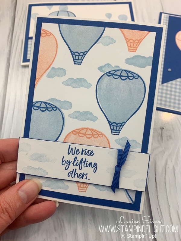 Use masks to layer the clouds around the balloons with the Above the Clouds stamp set. 